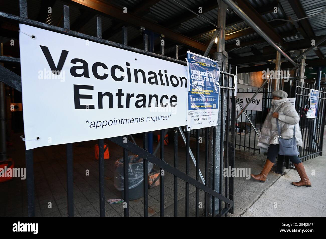 A woman enters a COVID-19 Vaccination Hub in the Elmhurst section of the Queens borough of New York City, NY, January 23, 2021. New York City has ordered 15 if its COVID-19 Vaccinations hubs closed and appointments cancelled due to a shortage of the COVID-19 vaccine; the United States recently surpassed 400,000 deaths due to Coronavirus infections.  (Photo by Anthony Behar/Sipa USA) Stock Photo