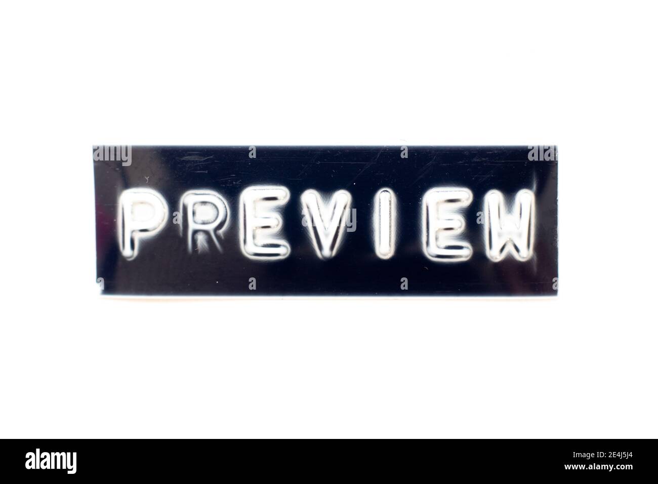 Embossed letter in word preview on black banner with white background