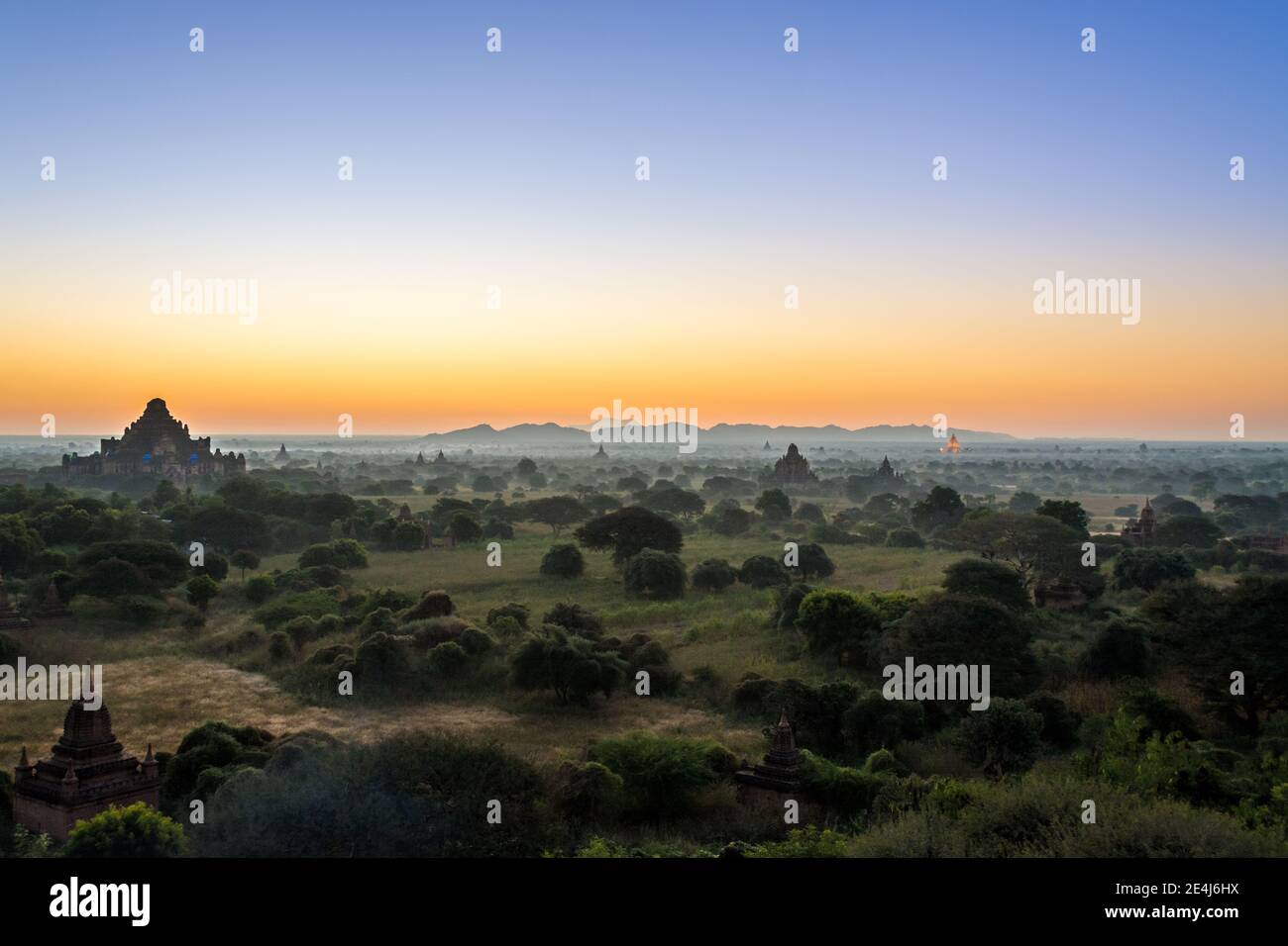 Bagan, Myanmar - View of pagodas at sunrise. Landscape of the Bagan Archaeological Zone. UNESCO World Heritage Site in the Mandalay Region of Myanmar. Stock Photo