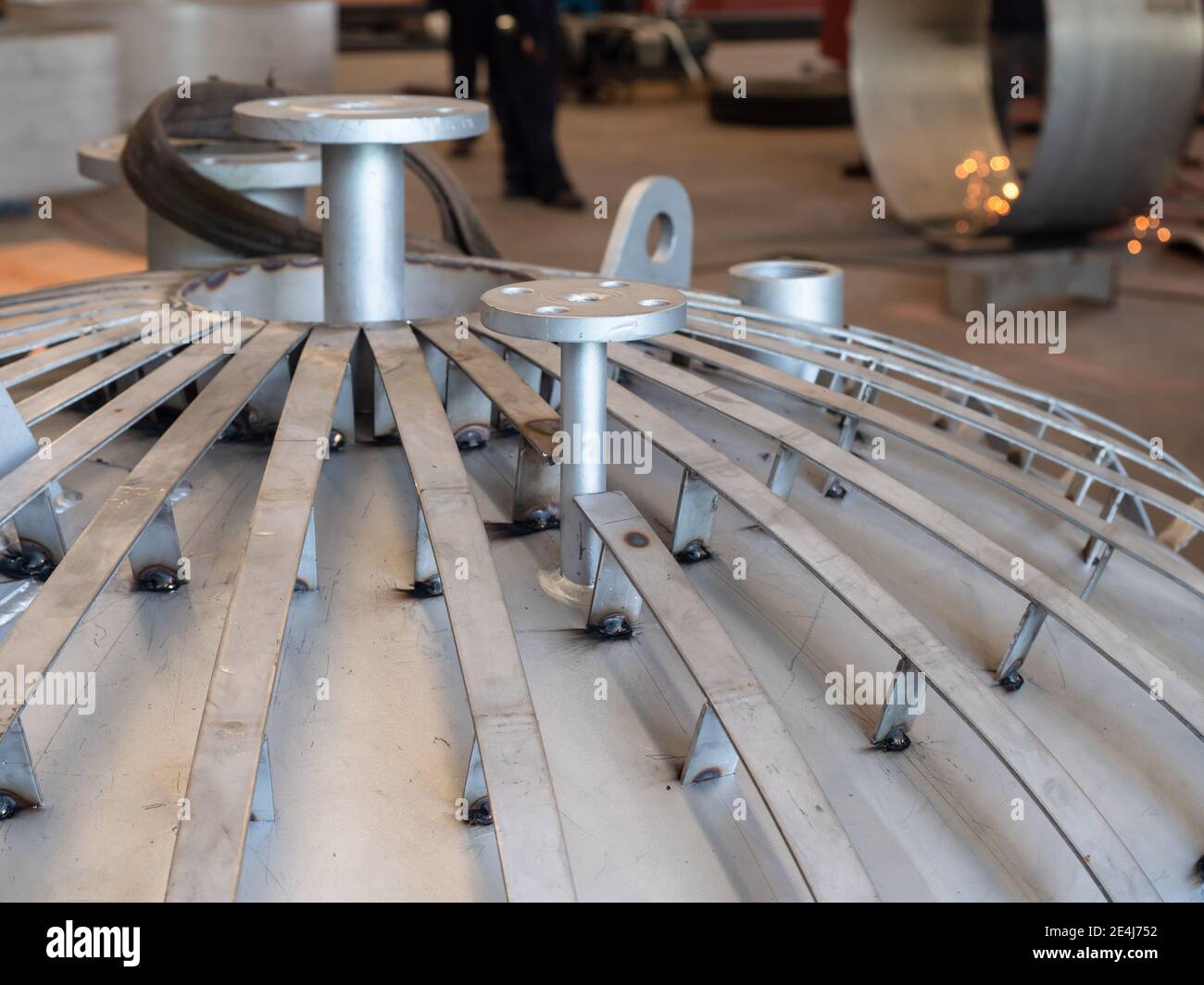 Insulated stainless steel tank being manufactured at an industrial