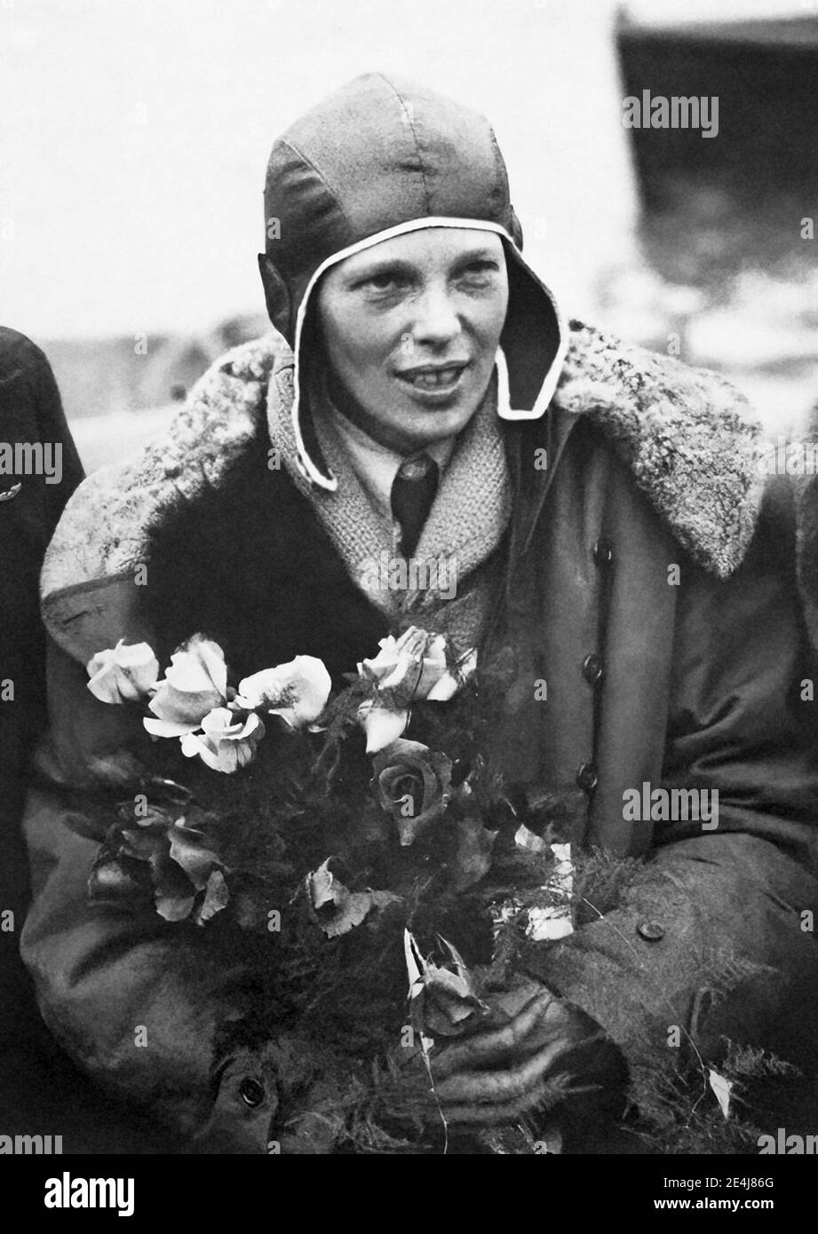 Amelia Earhart (1897-1937) in Southampton, England, after the successful completion of her transatlantic flight in 1928, a year after Charles Lindbergh's solo transatlantic flight. Since most of the flight was on instruments and Earhart had no training for this type of flying, she did not pilot the aircraft. In 1932, five years to the day after Lindbergh's historic flight, Earhart made her own nonstop solo transatlantic flight. Stock Photo