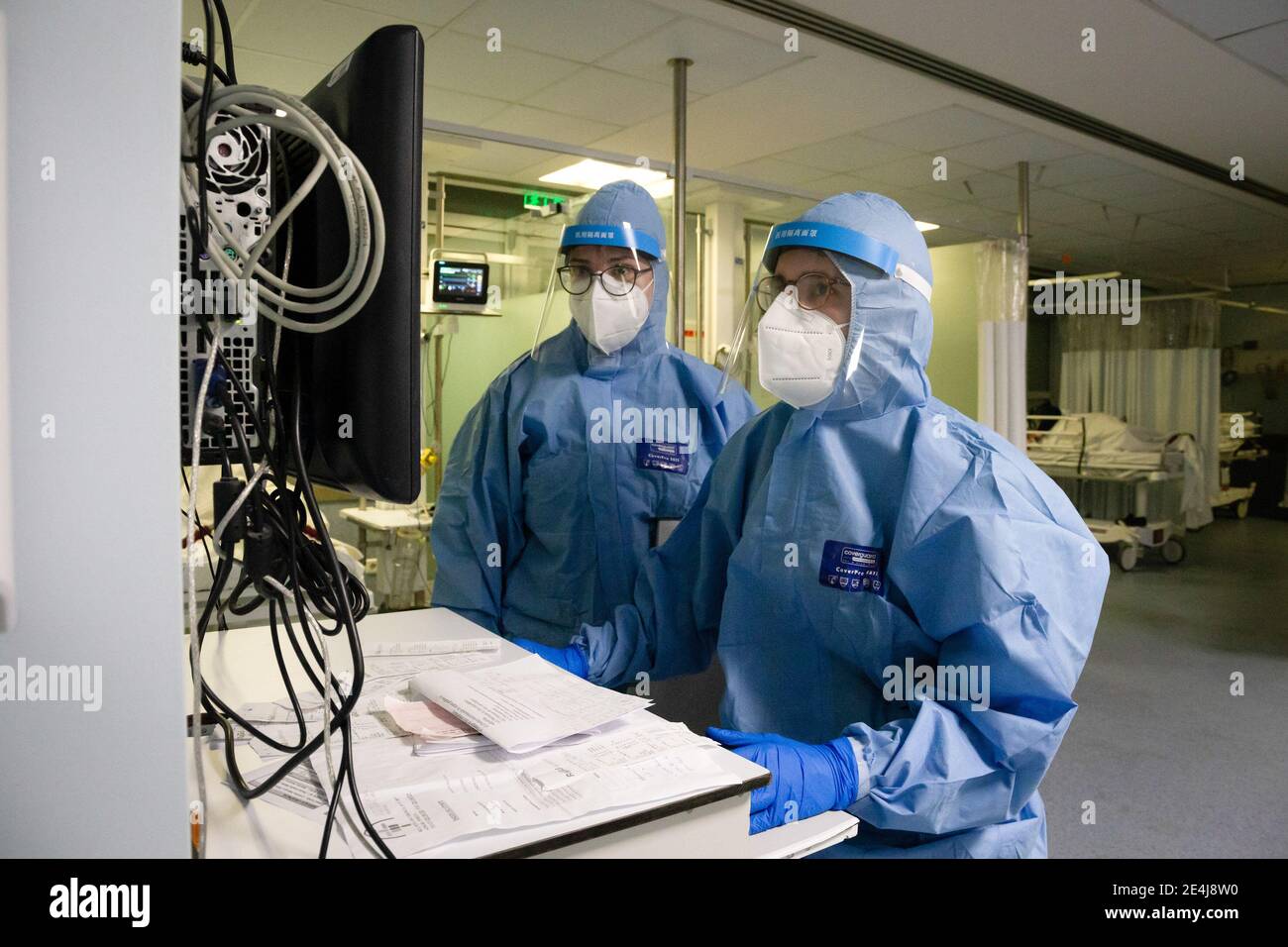 Porto, Portugal. 23rd Jan, 2021. Health workers wearing protective suits use  a computer to analyse the exams performed in the ward at the University  Hospital of São João do Porto.The University Hospital