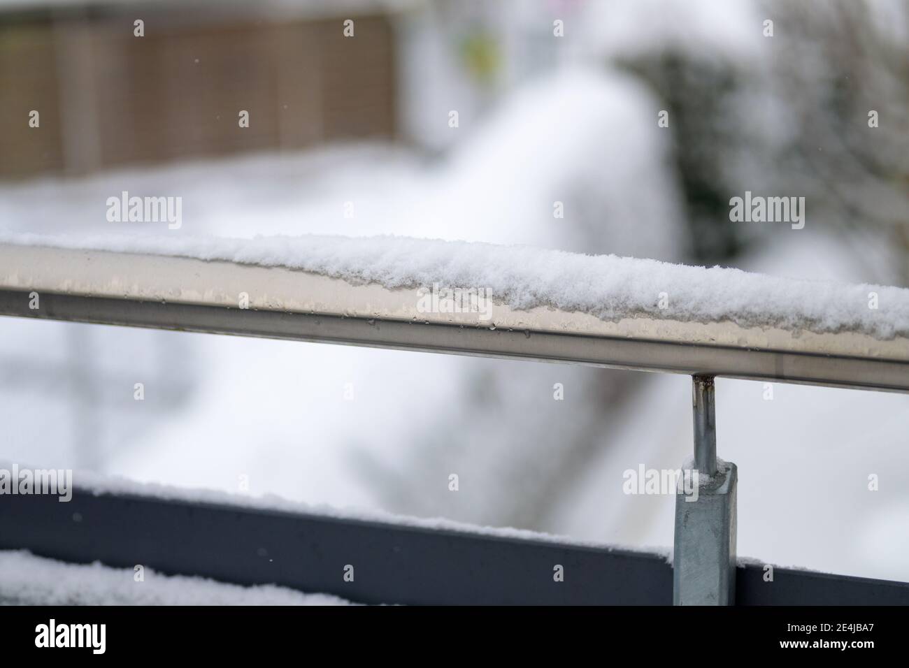 snow on the railing of a balcony in close up Stock Photo