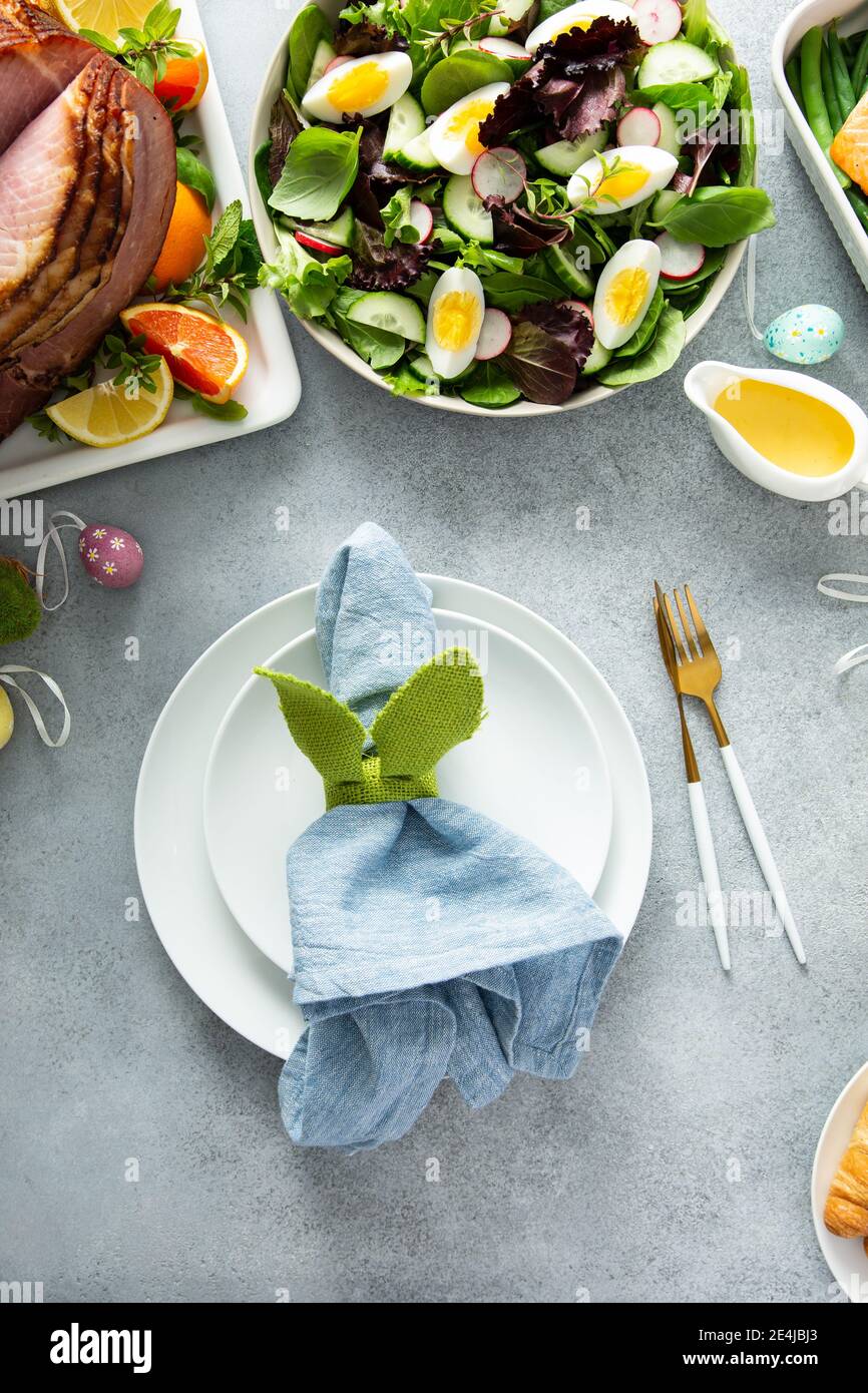 Easter brunch table setting with a napkin on a plate Stock Photo