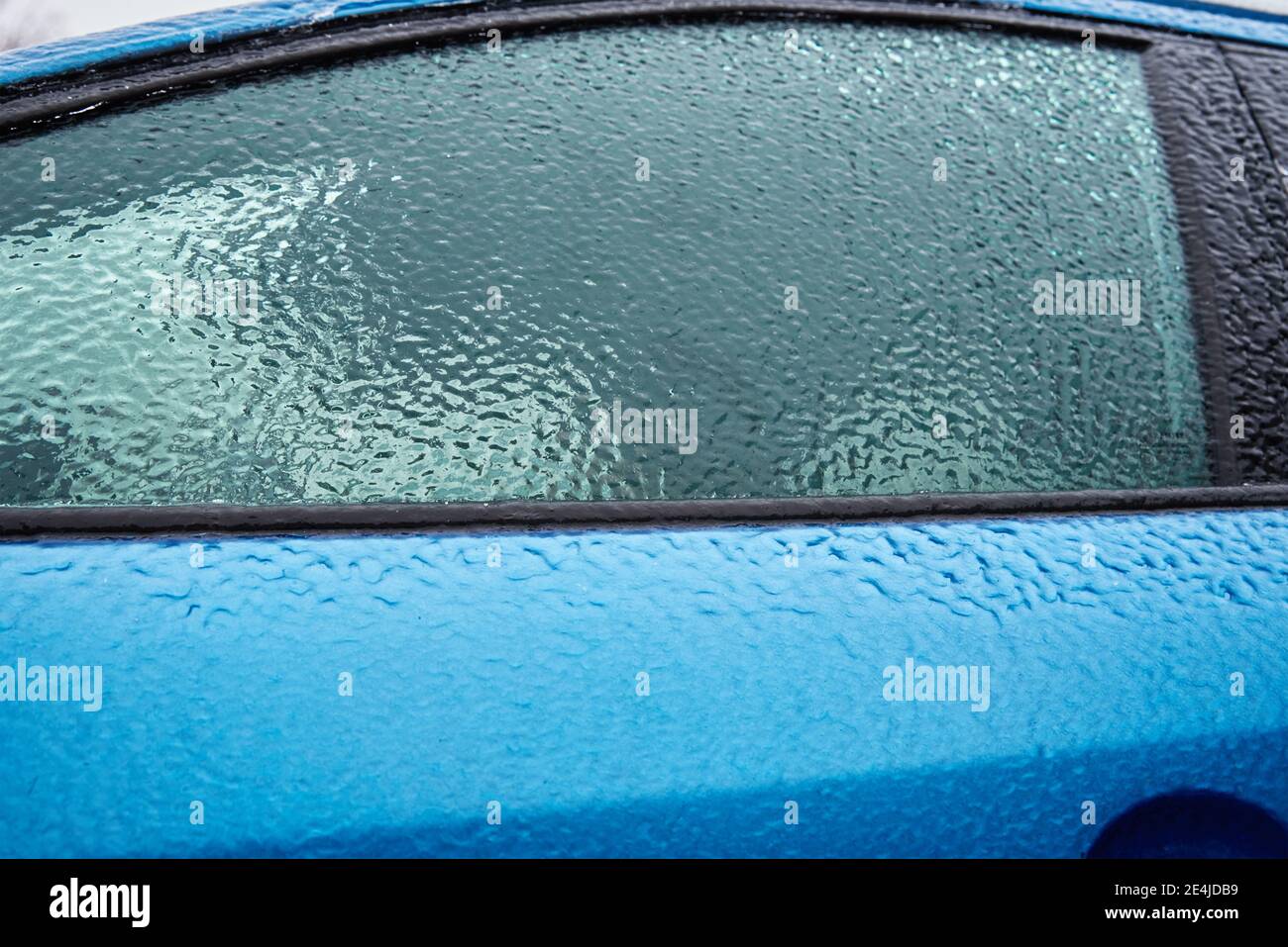Car covered in freezing rain. Extreme winter weather for a driving