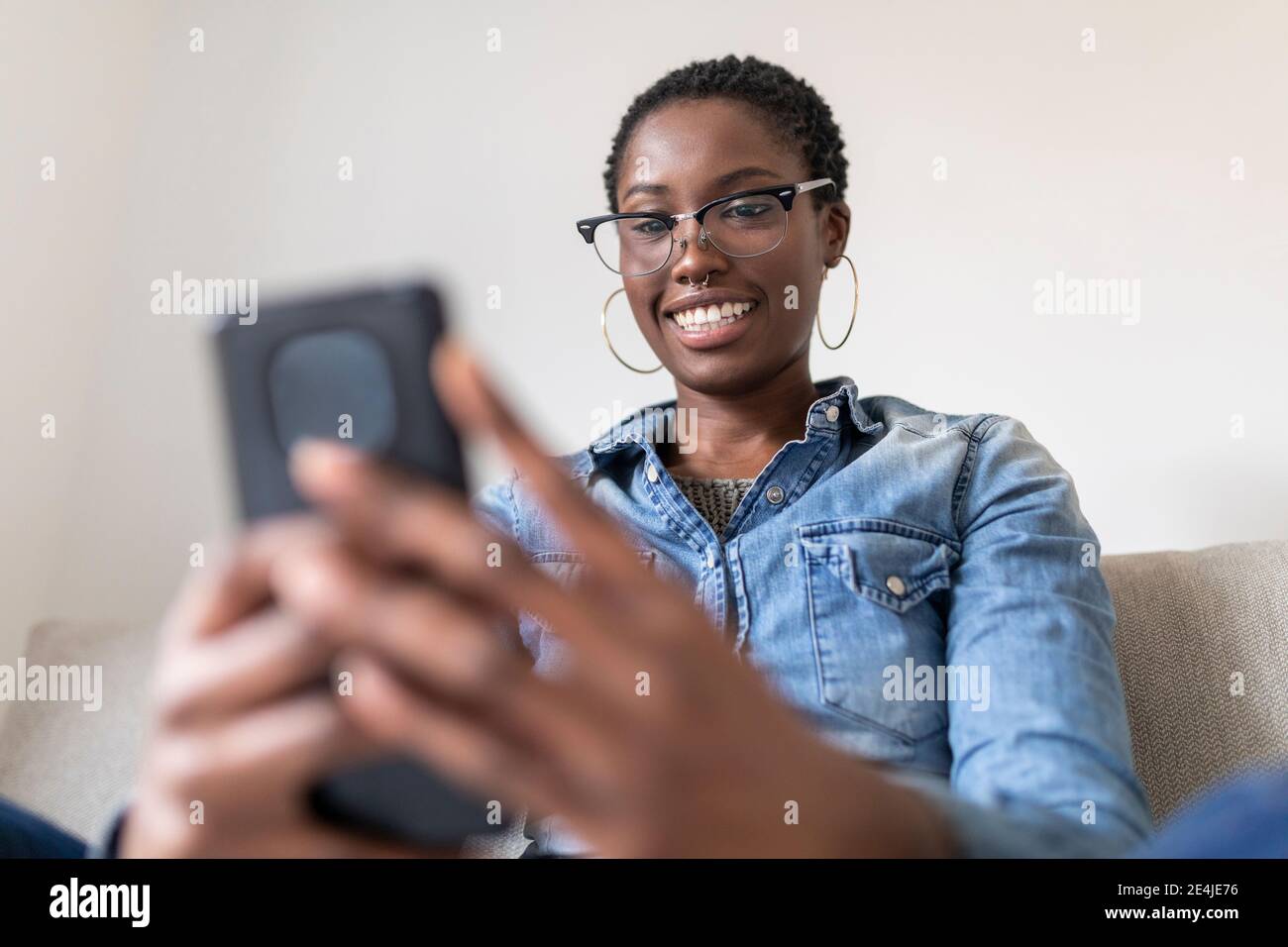 Smiling woman having video call Stock Photo