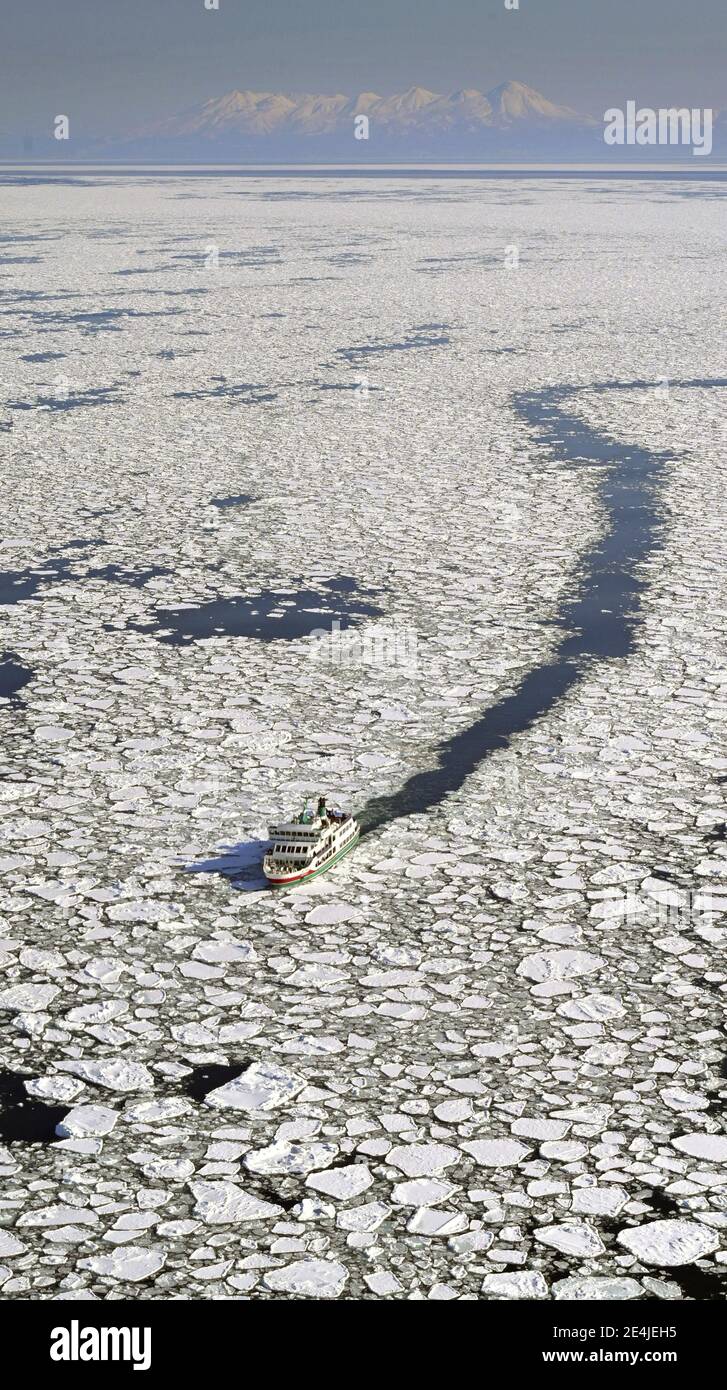 Photo taken from a Kyodo News helicopter shows an ice breaking ship sailing through drift ice off Hokkaido's Abashiri, northern Japan, on Jan. 24, 2021. (Kyodo)==Kyodo Photo via Credit: Newscom/Alamy Live News Stock Photo