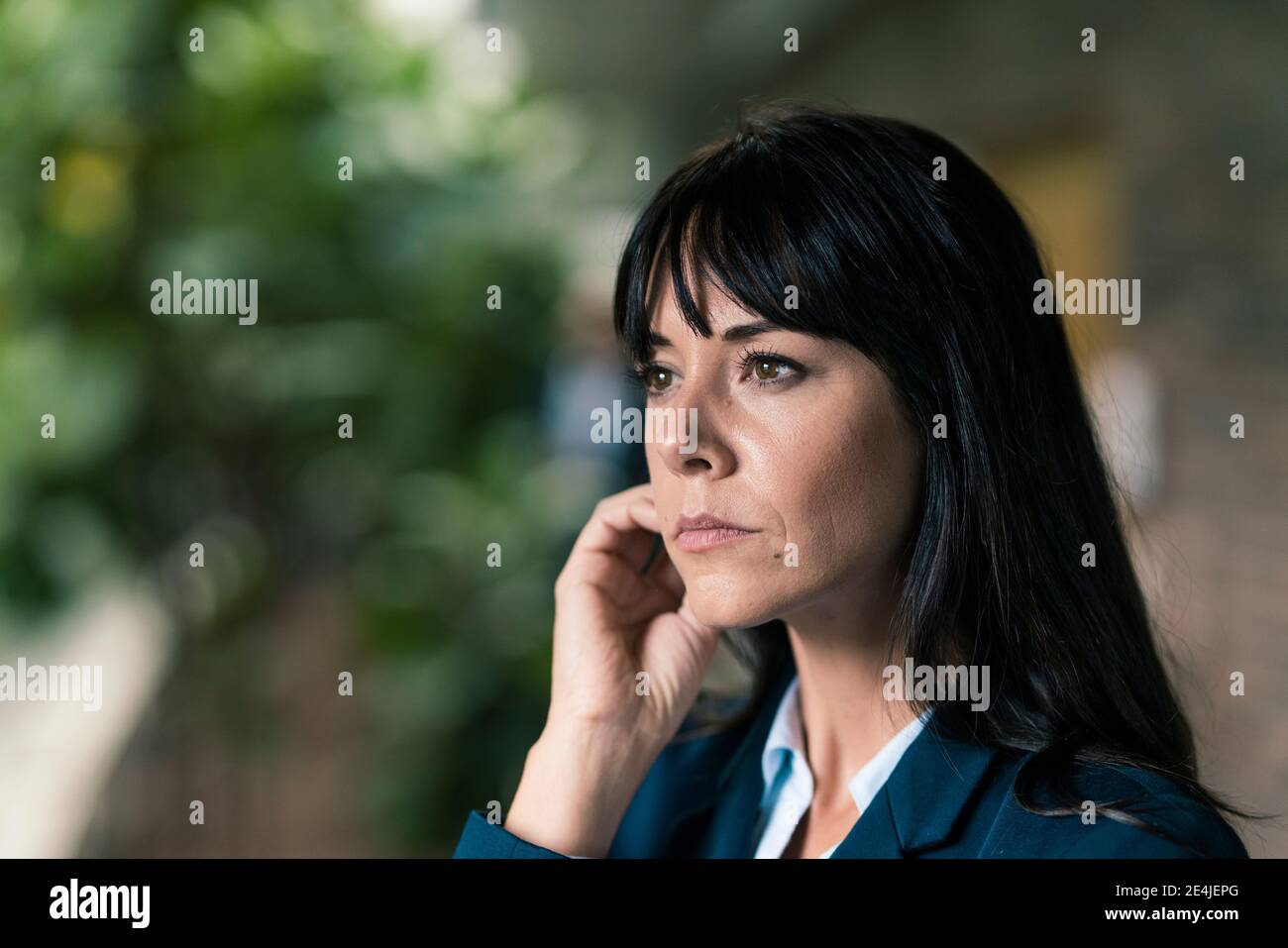 Elegant female entrepreneur looking away Stock Photo