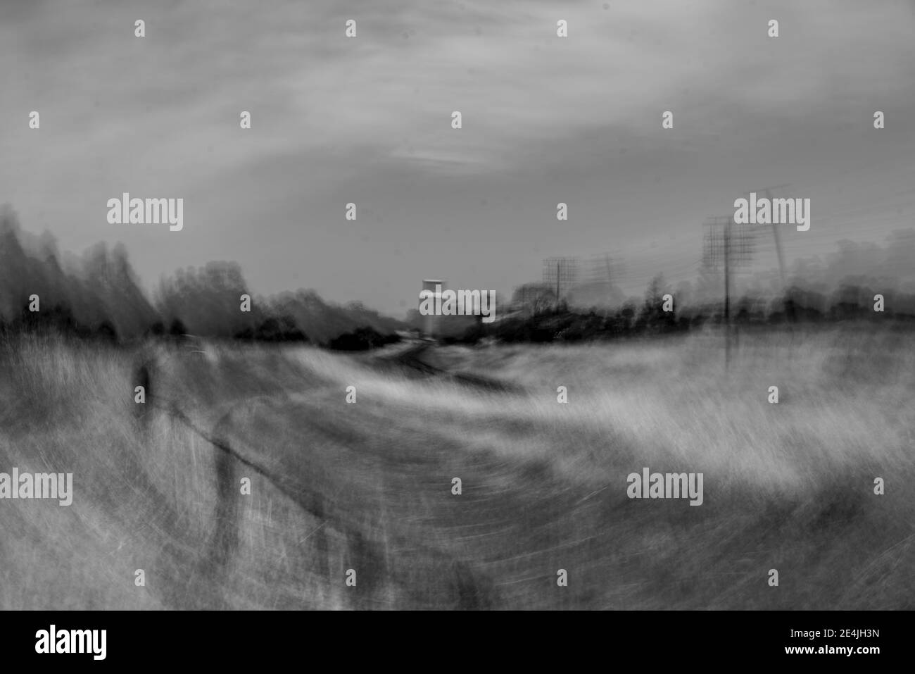 Concrete Grain Storage silos, ICM rural scene monochrome Stock Photo