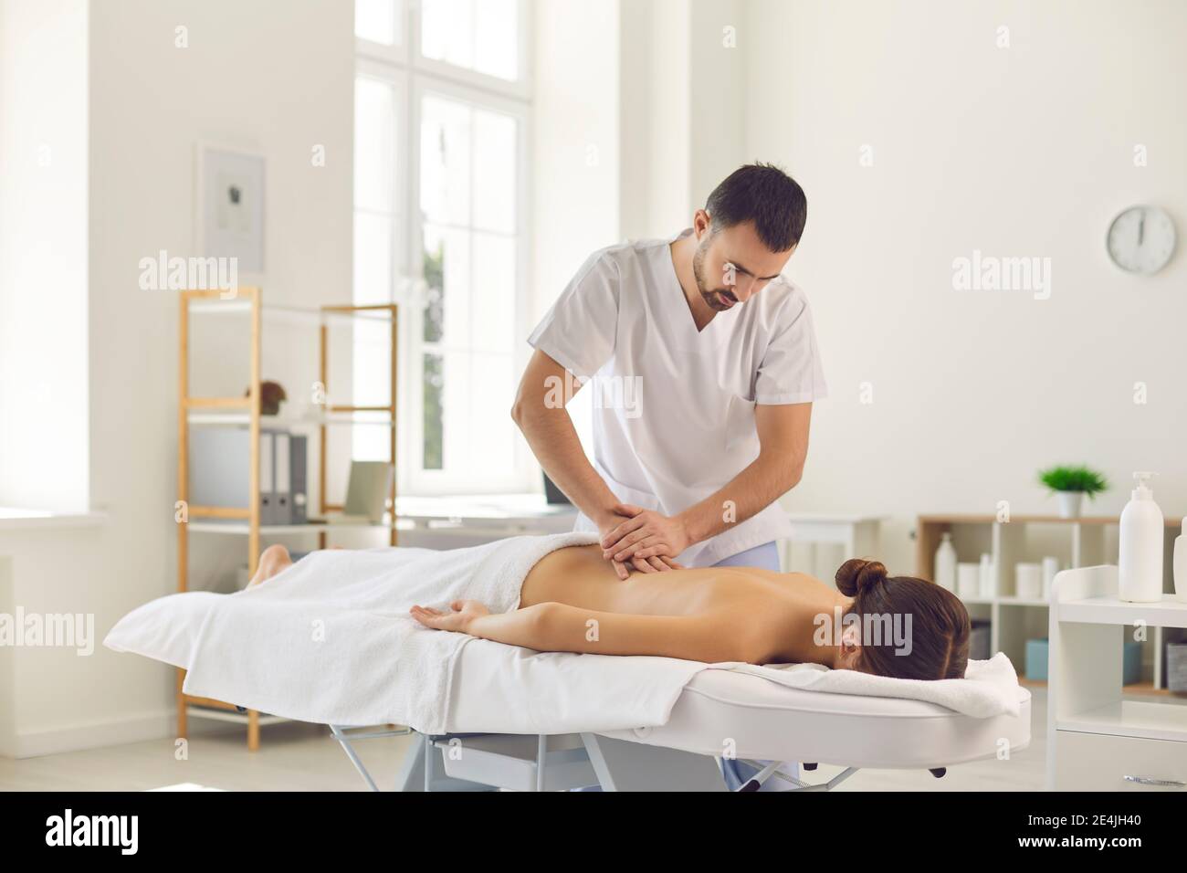 Massage session in medical clinic from professional doctor masseur Stock Photo