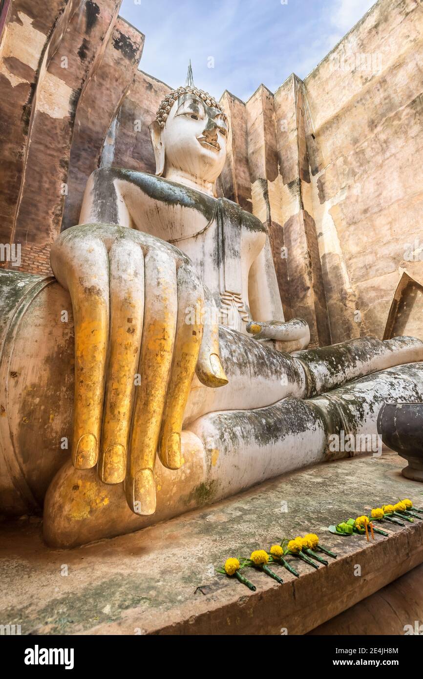 Famous big Buddha statue image named Phra Achana situated in ruined chapel at Wat Si Chum temple, Sukhothai Historical Park, Thailand Stock Photo