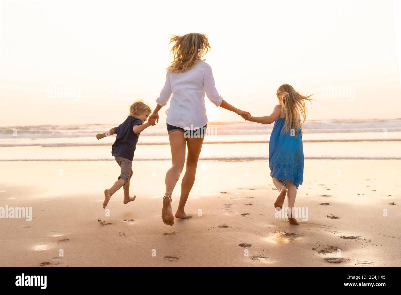 Boy And Girl Running Into The Sunset And Holding Hands High Resolution Stock Photography And Images Alamy Boy And Girl Running Into The Sunset And Holding Hands High Resolution Stock Photography And Images Alamy
