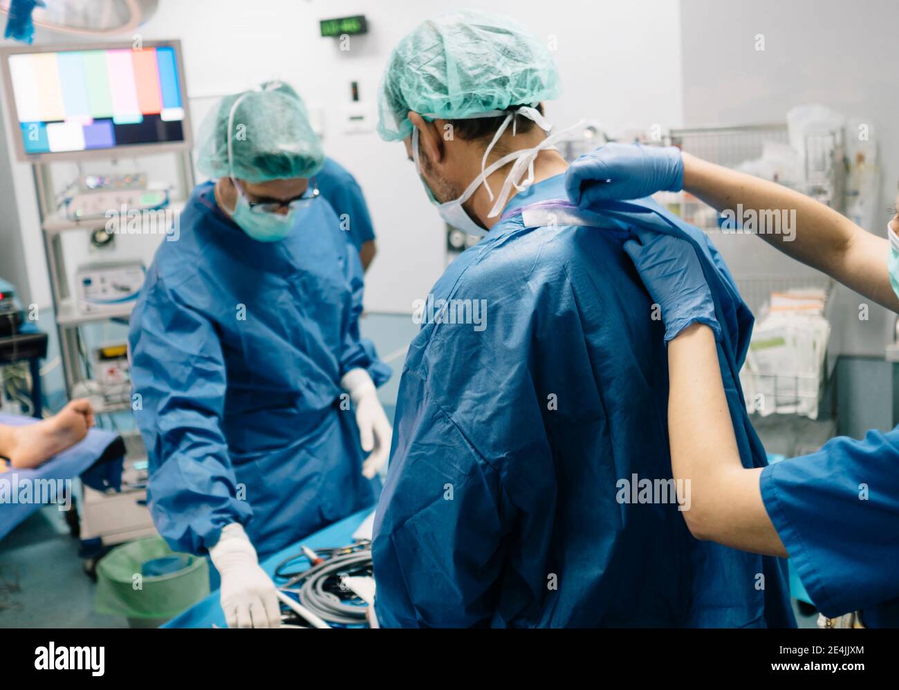 Male surgeons operating knee surgery in emergency room at hospital Stock Photo