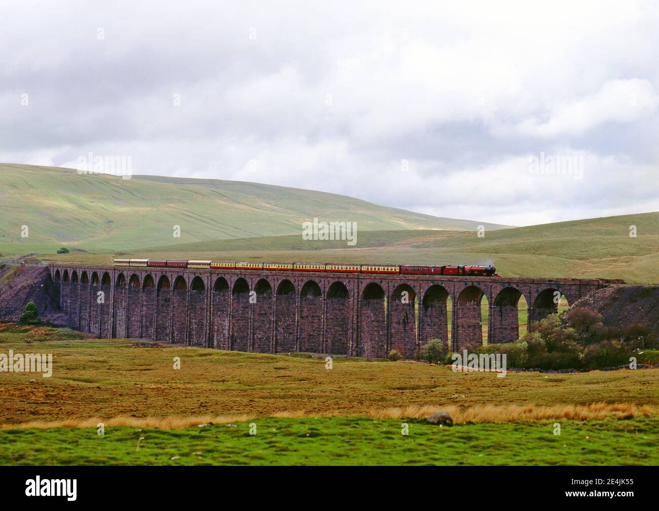 Steam train over Ribblehead viaduct on the Settle to Carlsile railway, England Stock Photo