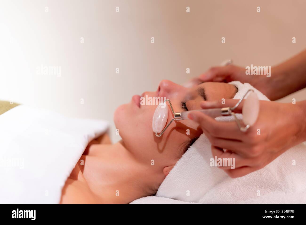 Young female customer receiving spa treatment from beautician Stock Photo