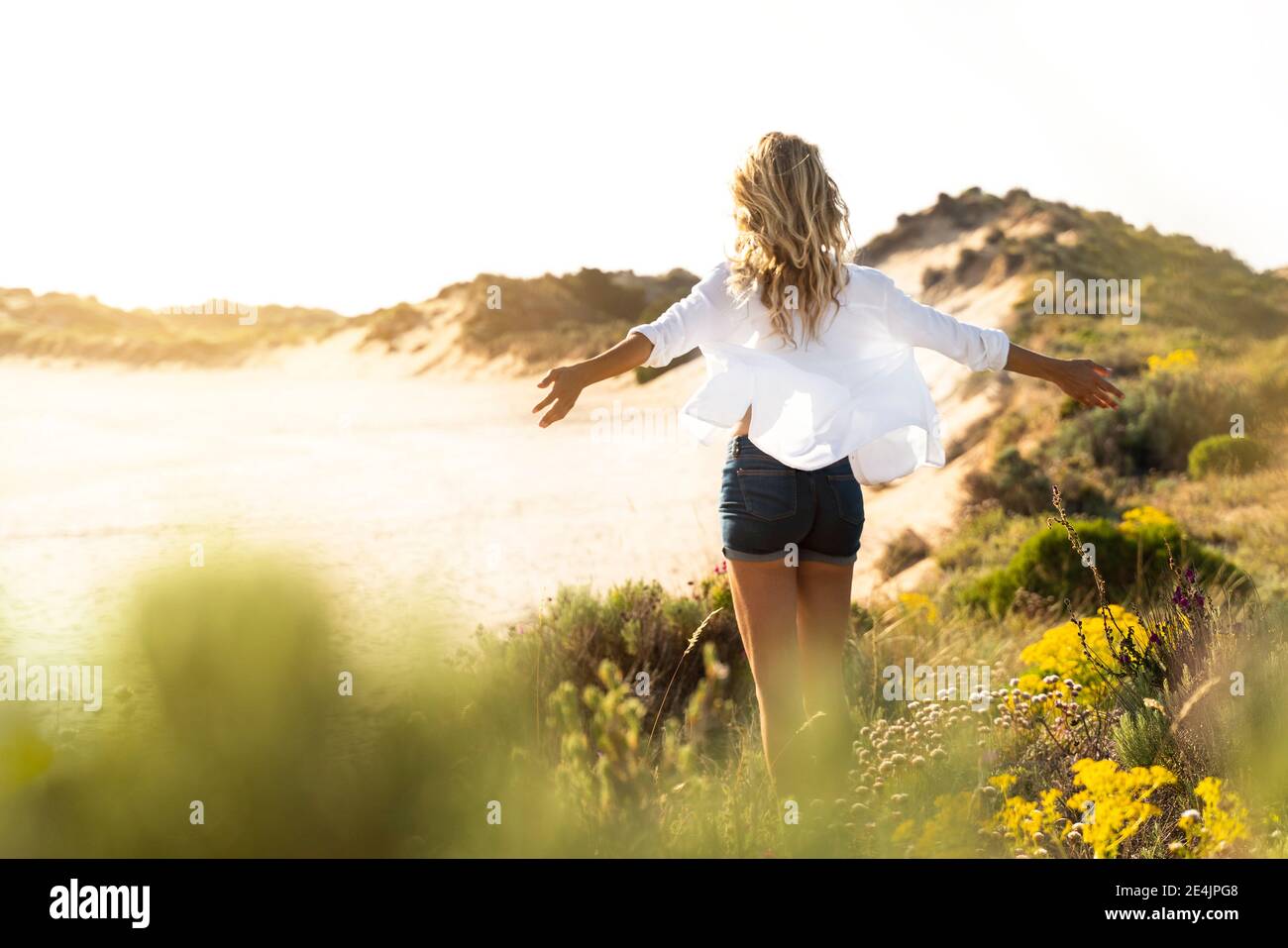 Carefree and woman rear view hi-res stock photography and images - Alamy