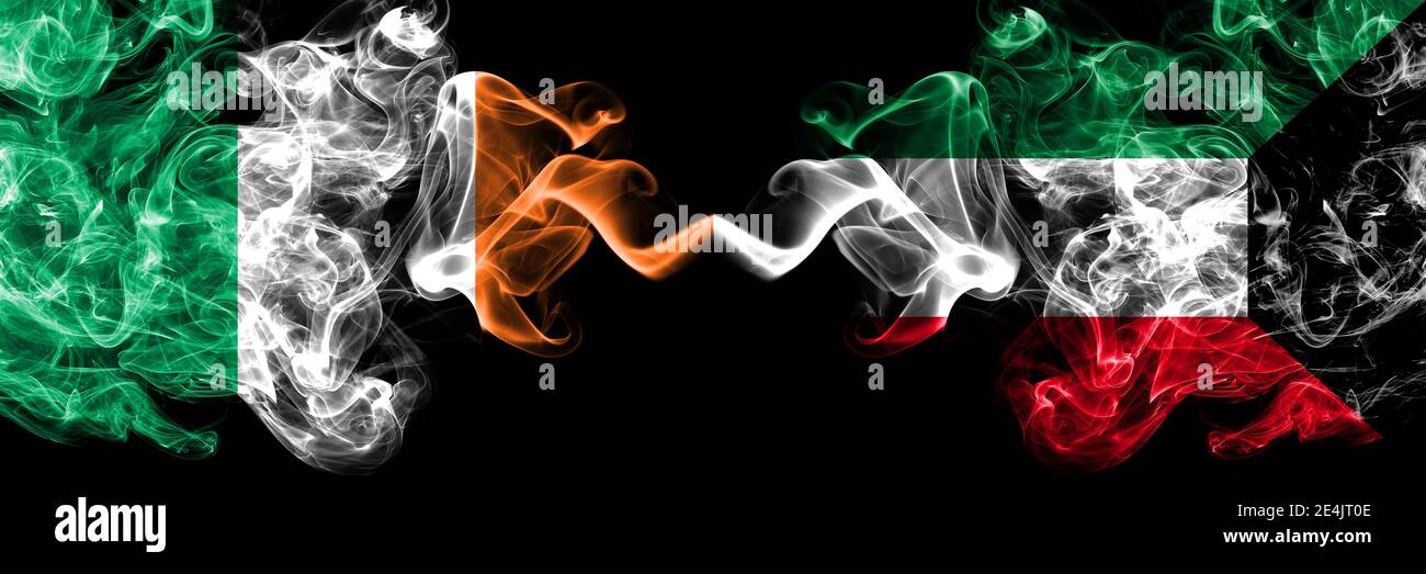 Republic of Ireland, Irish vs Kuwait, Kuwaiti smoky mystic flags placed side by side. Thick colored silky abstract smoke flags. Stock Photo