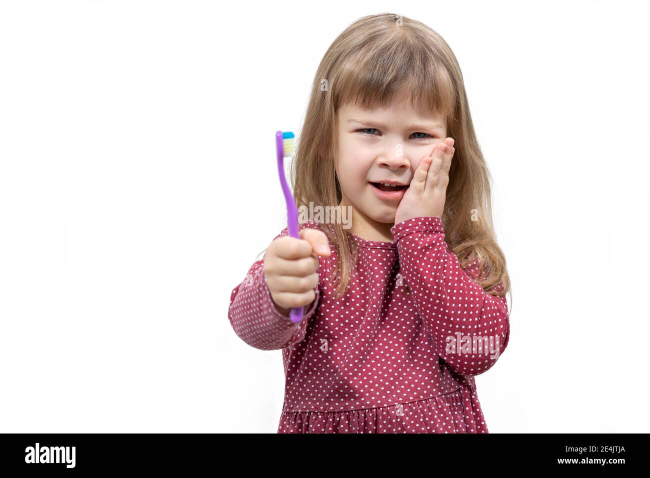 child has pain when brushing teeth. isolate on white background Stock