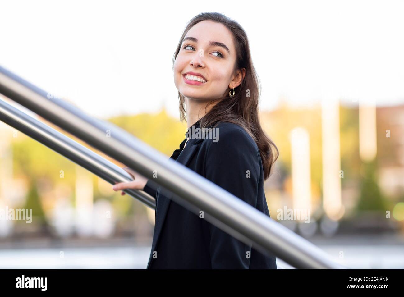 Standing by railing hi-res stock photography and images - Alamy