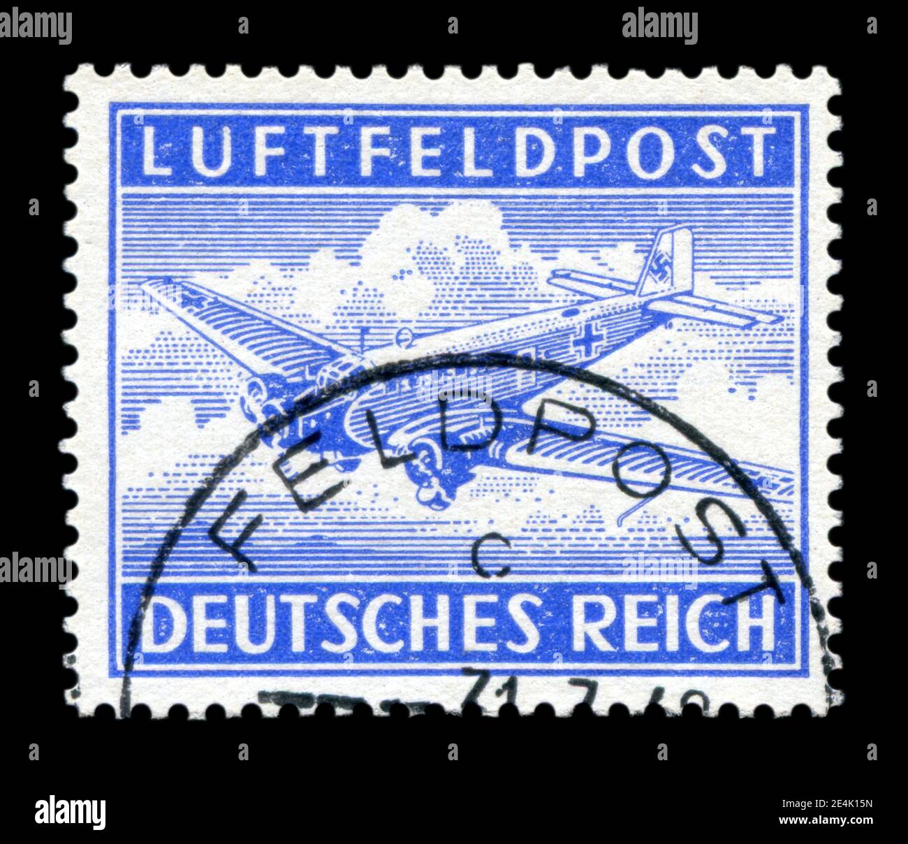 GERMANY - CIRCA 1942: German historical postage stamp: Ju 52 transport aircraft with swastika, air field mail, postmark, world war II, 1939-1945 Stock Photo