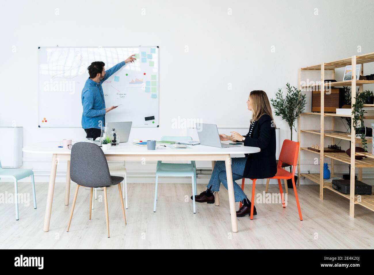 Business people pointing table brainstorming hi-res stock photography ...