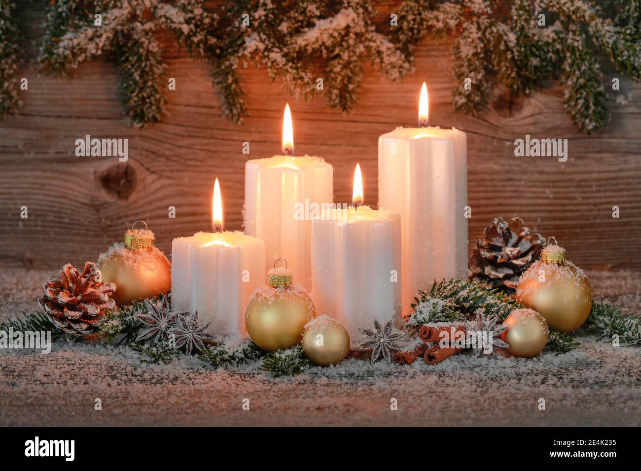Natural advent decoration with 4 burning candles Stock Photo