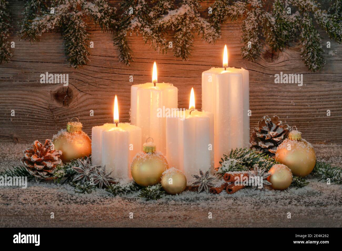 Natural advent decoration with 4 burning candles Stock Photo
