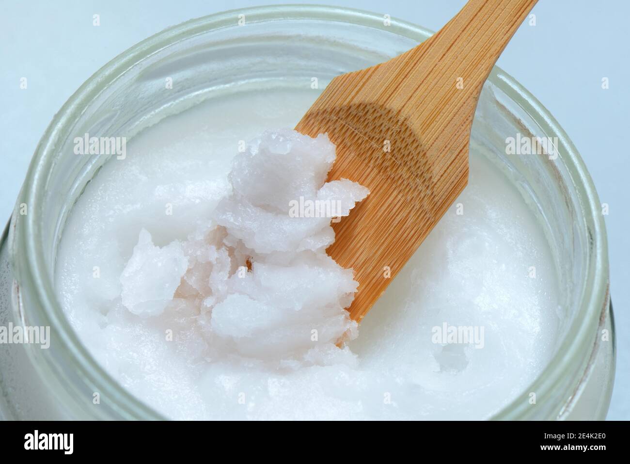 Coconut oil with bamboo spatula Stock Photo Alamy