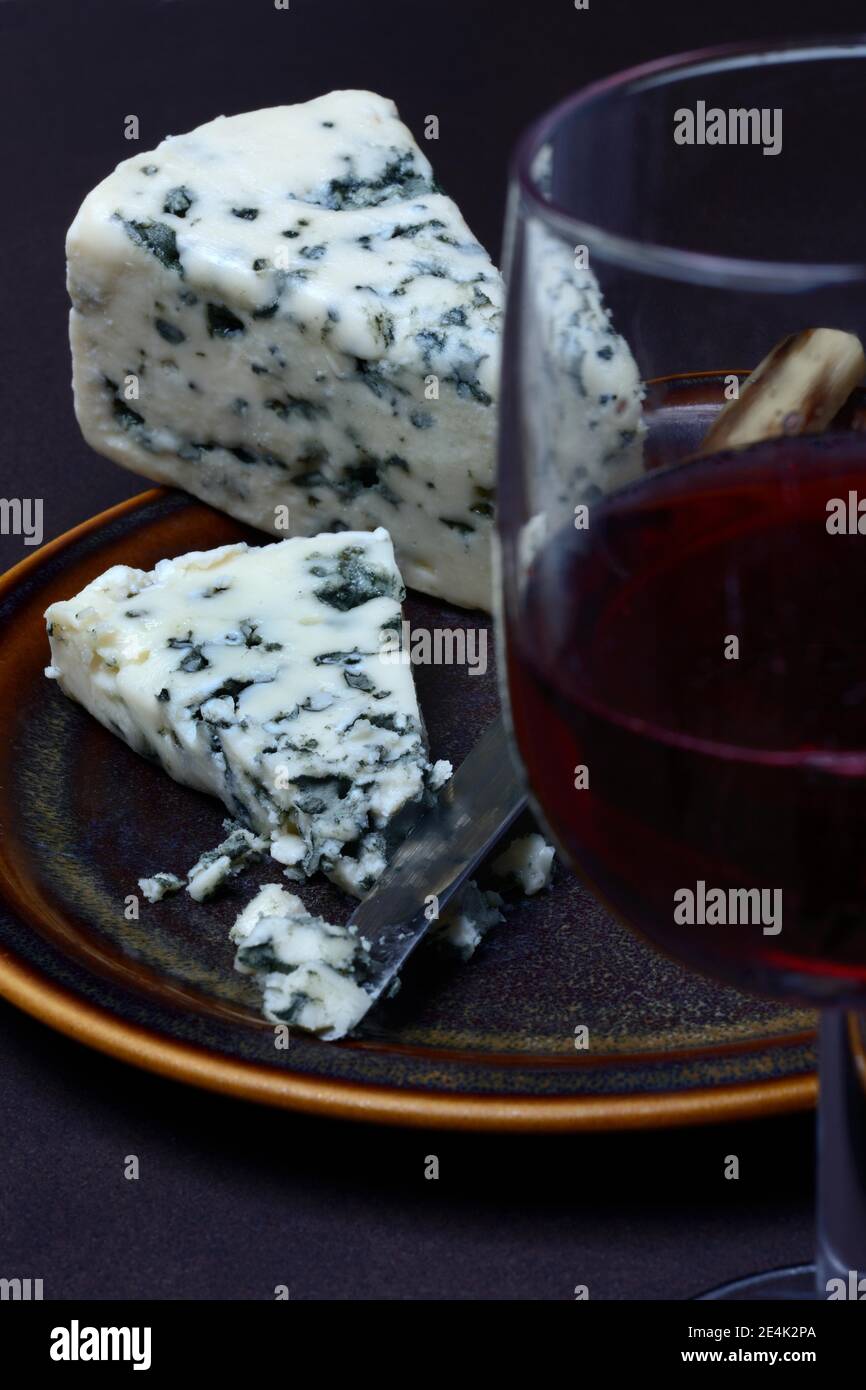 Roquefort, blue cheese, glass with red wine Stock Photo Alamy