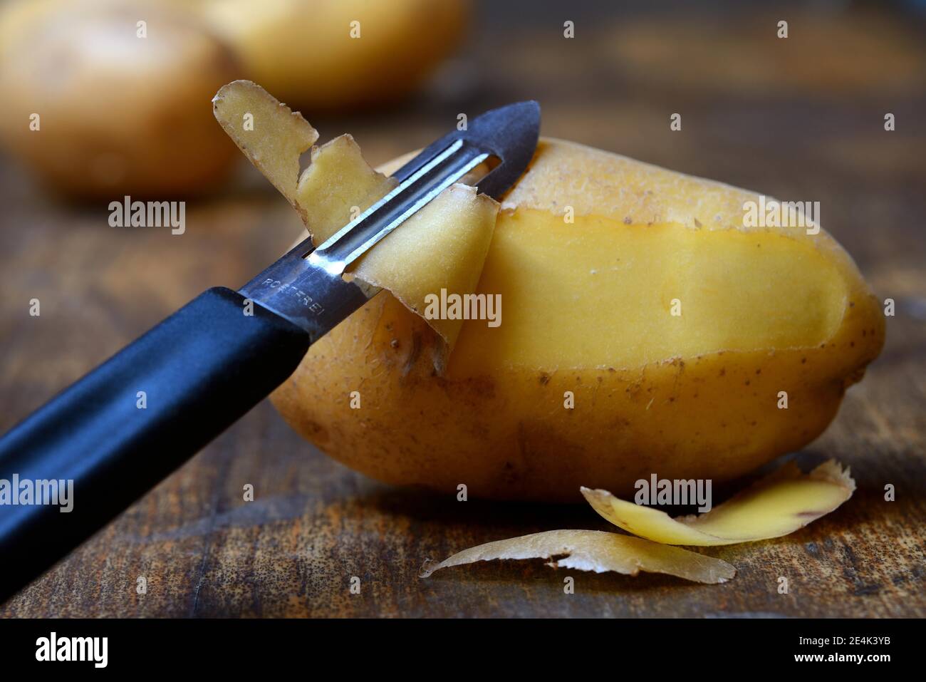 Potato peeling with peeler, Solanum tuberosum, potato peel, potato peel
