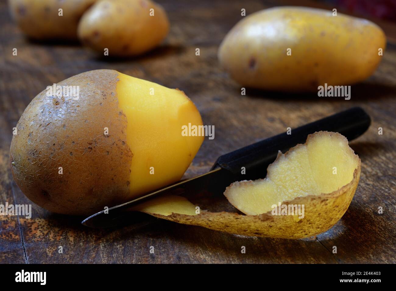 Potato peeling with peeler, Solanum tuberosum, potato peel, potato peel