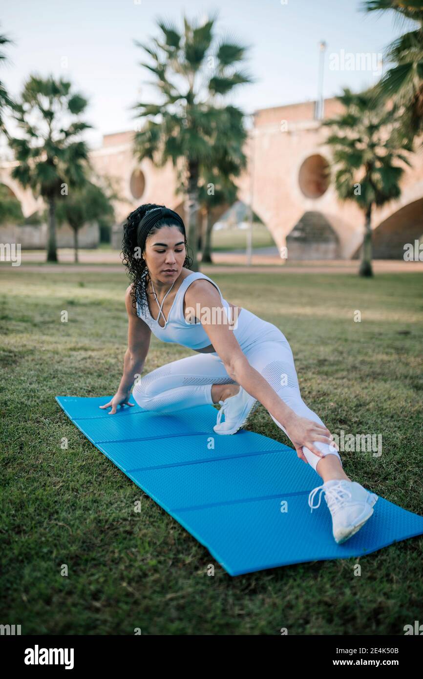 Athlete stretching in grass hi-res stock photography and images - Alamy