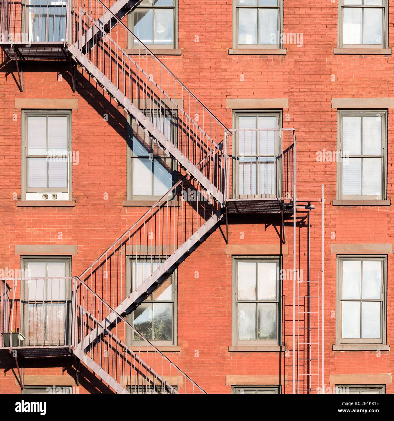 USA, New York, New York City, Fire escape on brick apartment building in Greenwich Village Stock Photo