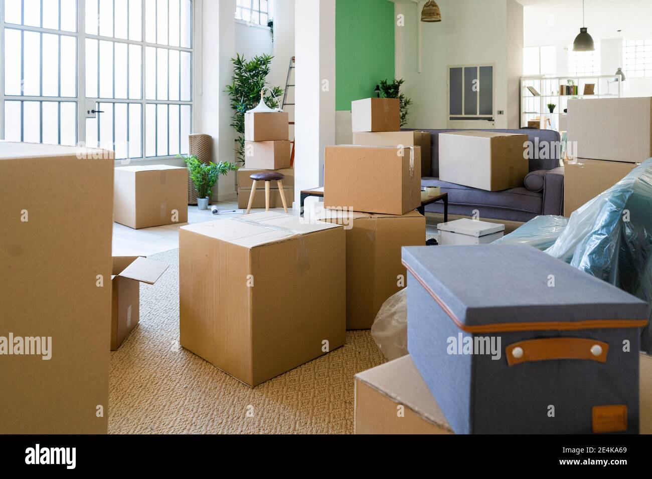 Cardboard boxes in new home during relocation Stock Photo