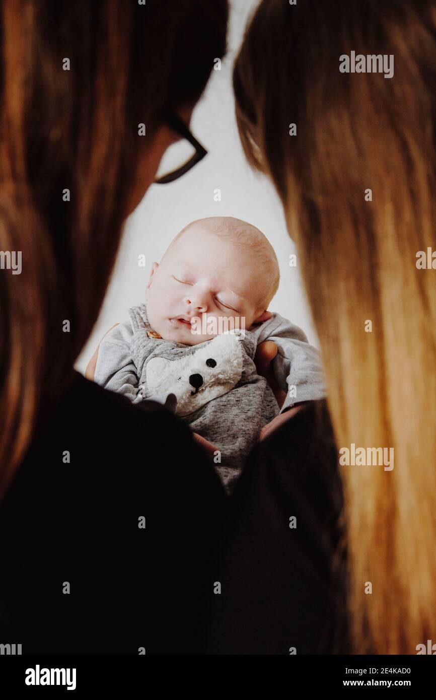 Parents with newborn boy in studio Stock Photo