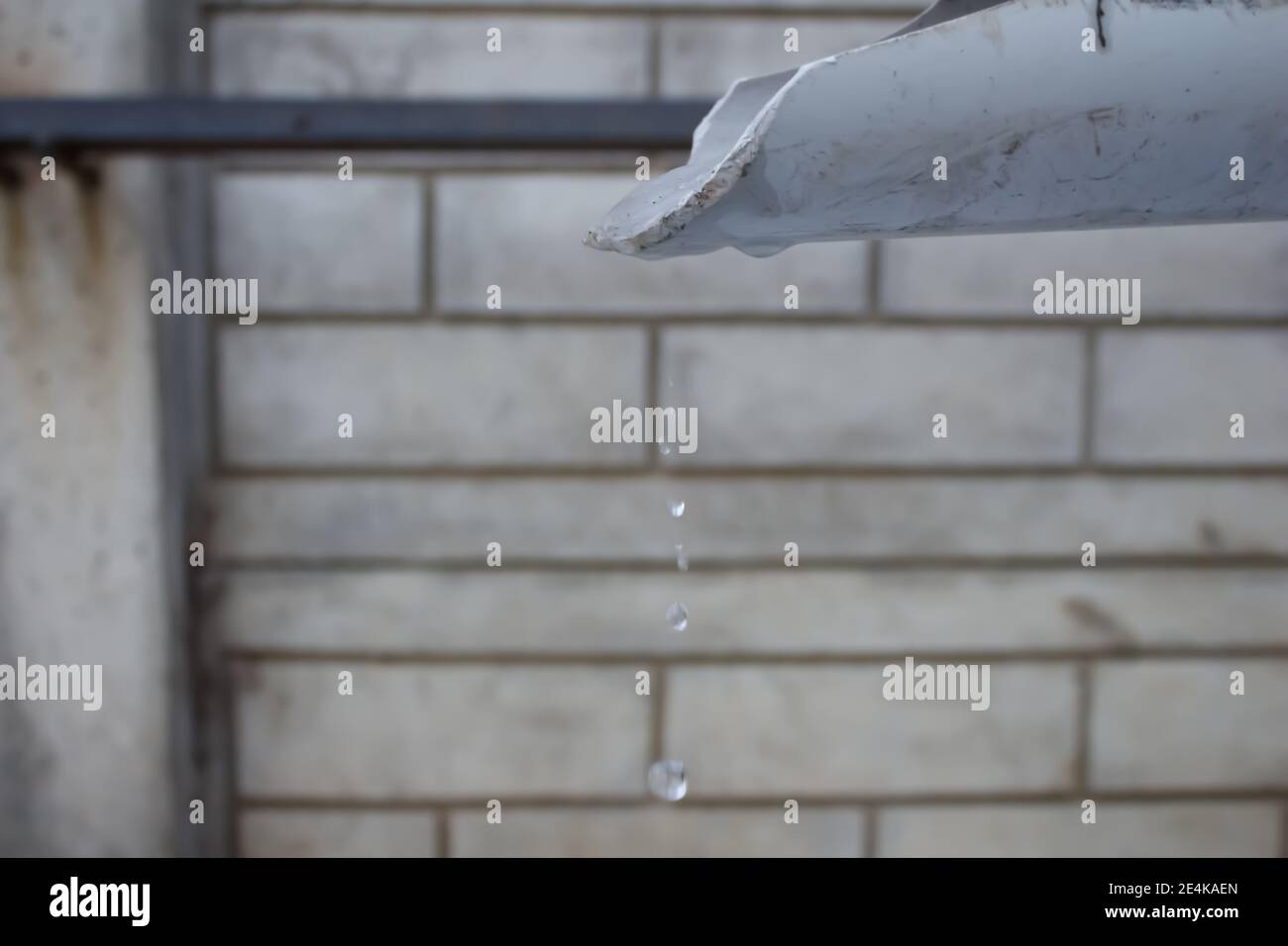 Drops of water falling from melting ice. Drought or global warming or ...