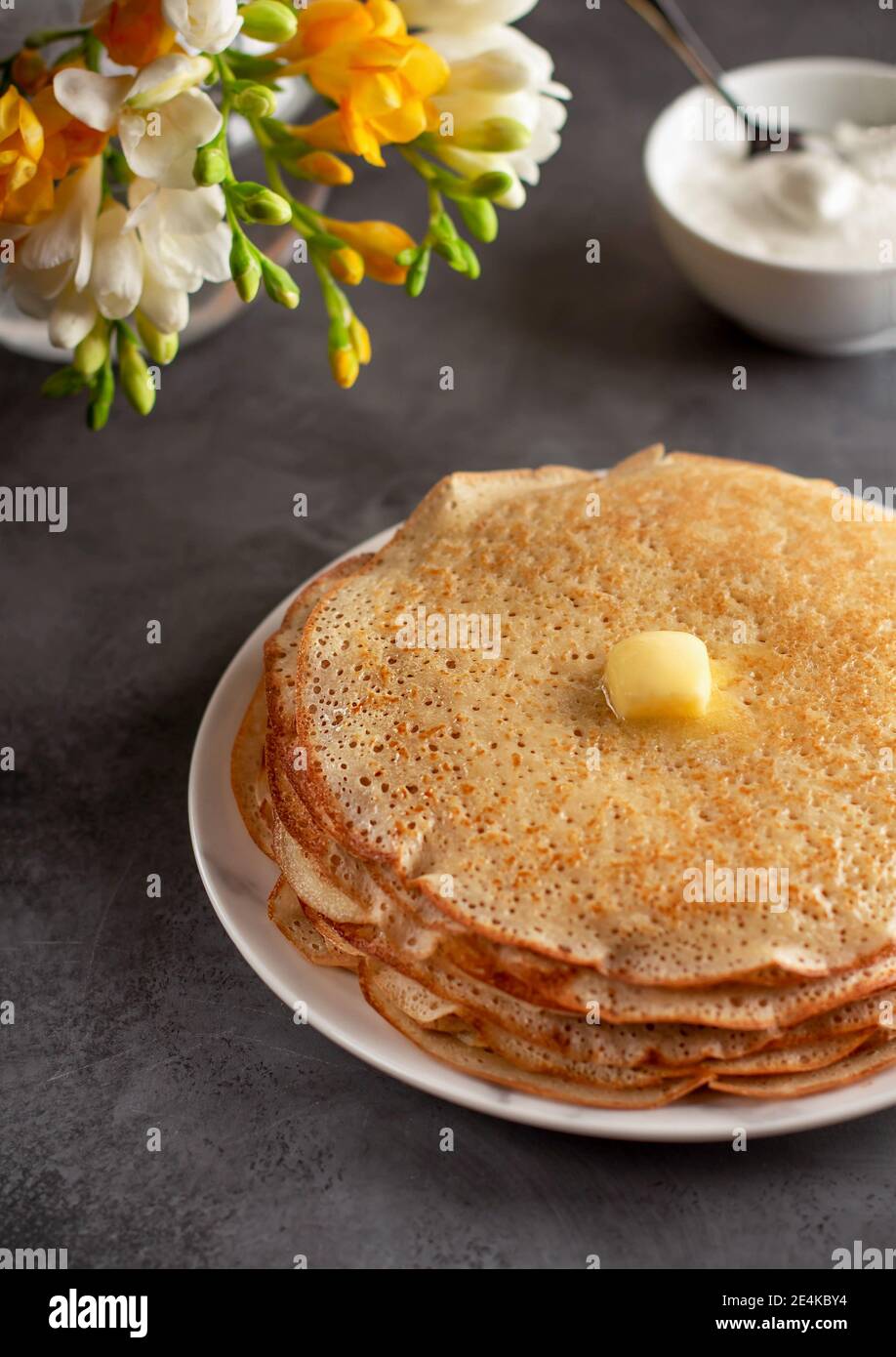 Tasty traditional russian breakfast of pancakes with honey on plate. Rustic  style. Stock Photo by ©Svetlana_Cherruty 151382336