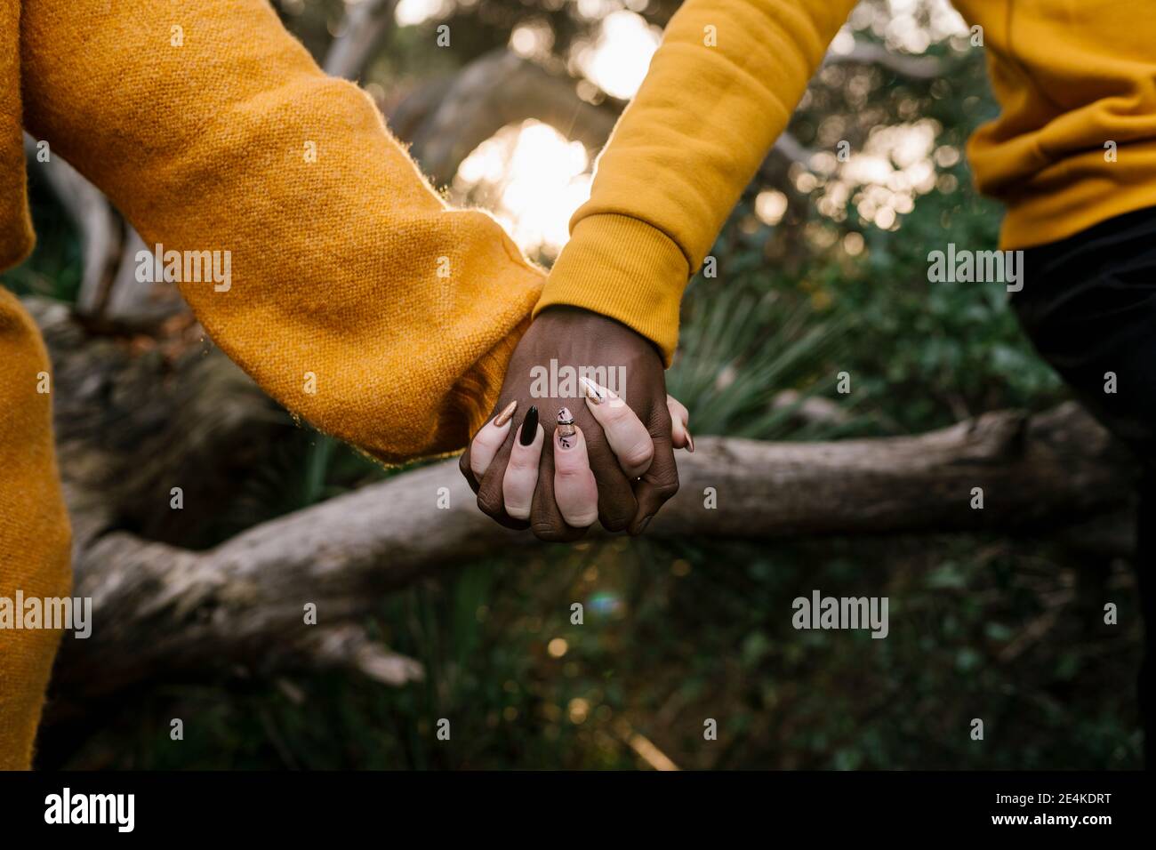 Image of woman holding hands up hi-res stock photography and images - Alamy