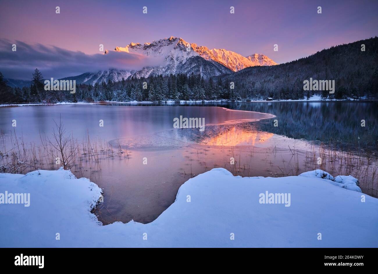 Scenic view of Lautersee lake with Karwendel mountain during sunset Stock Photo