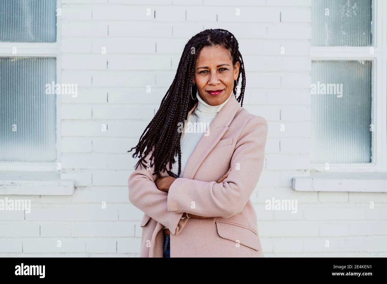 Confident woman long braided hair hi-res stock photography and images ...