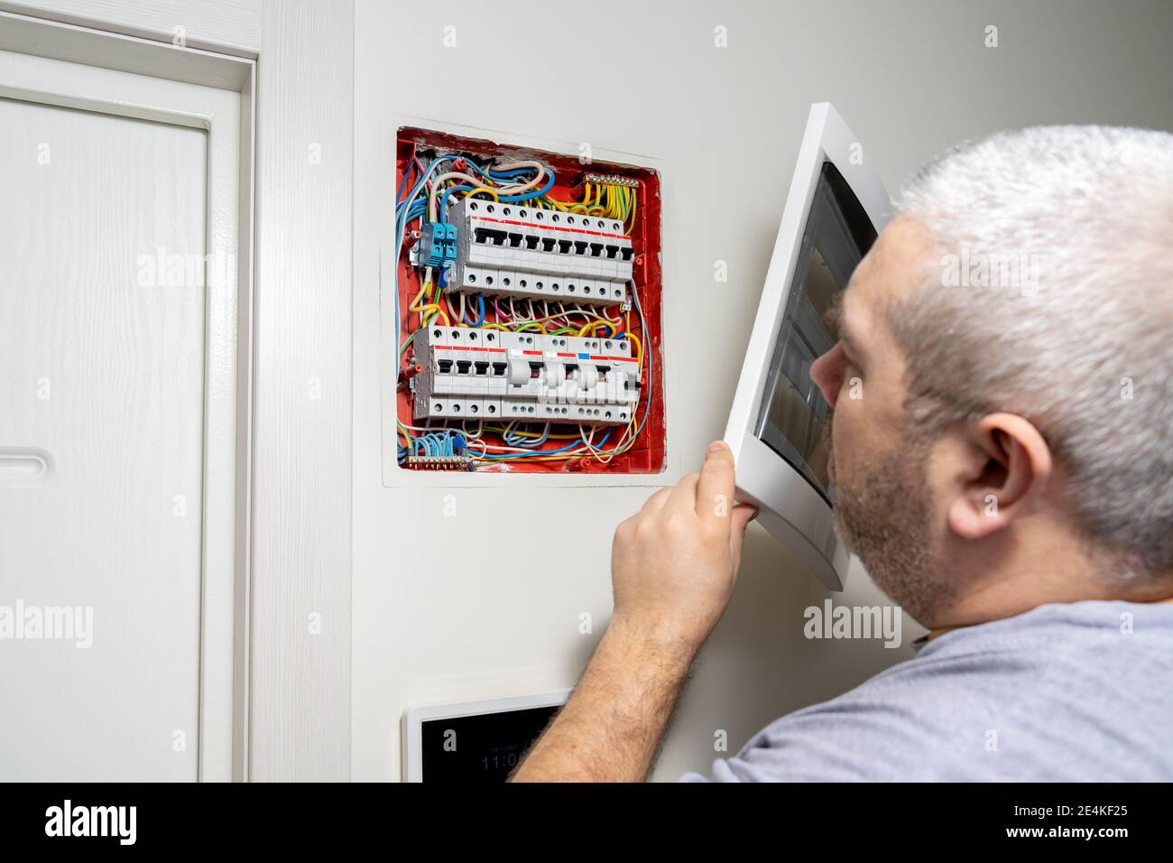 Electricity distribution box. Fuse box. man doing electrical work Stock
