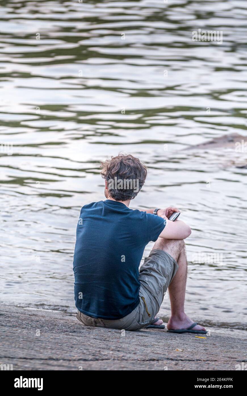 Lonely man bridge river hi-res stock photography and images - Alamy