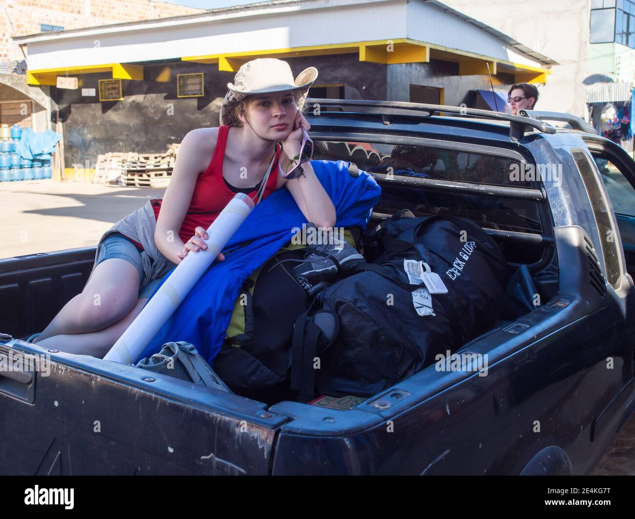 Benjamin Constant, Brazil - May 5, 2016: Backpacker travels on a car crate along the roads of the rainforest, Amazonia. Latin America Stock Photo