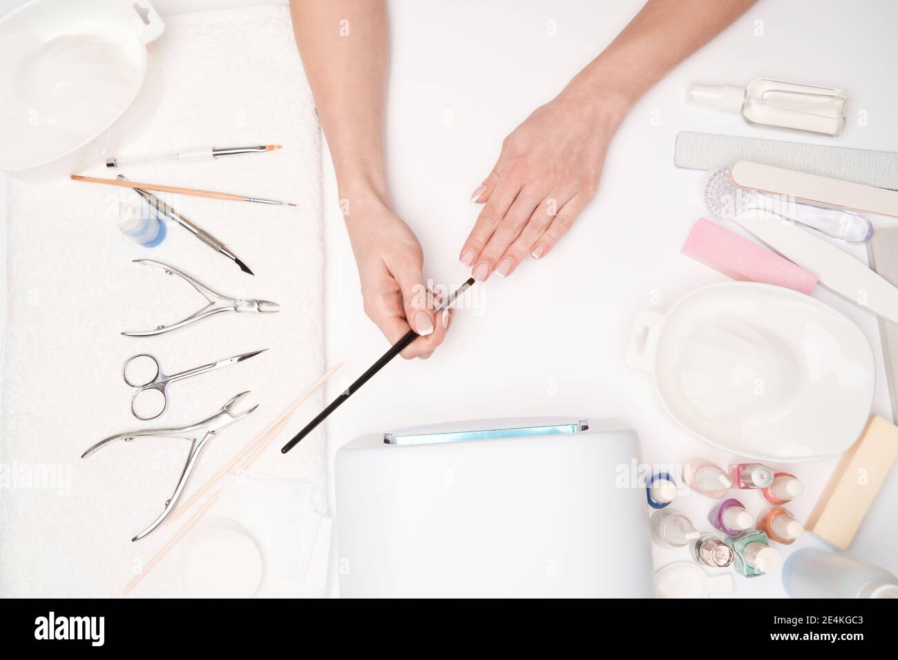 top view of manicure tools and Woman Preparing her hands for getting manicure procedure Stock Photo