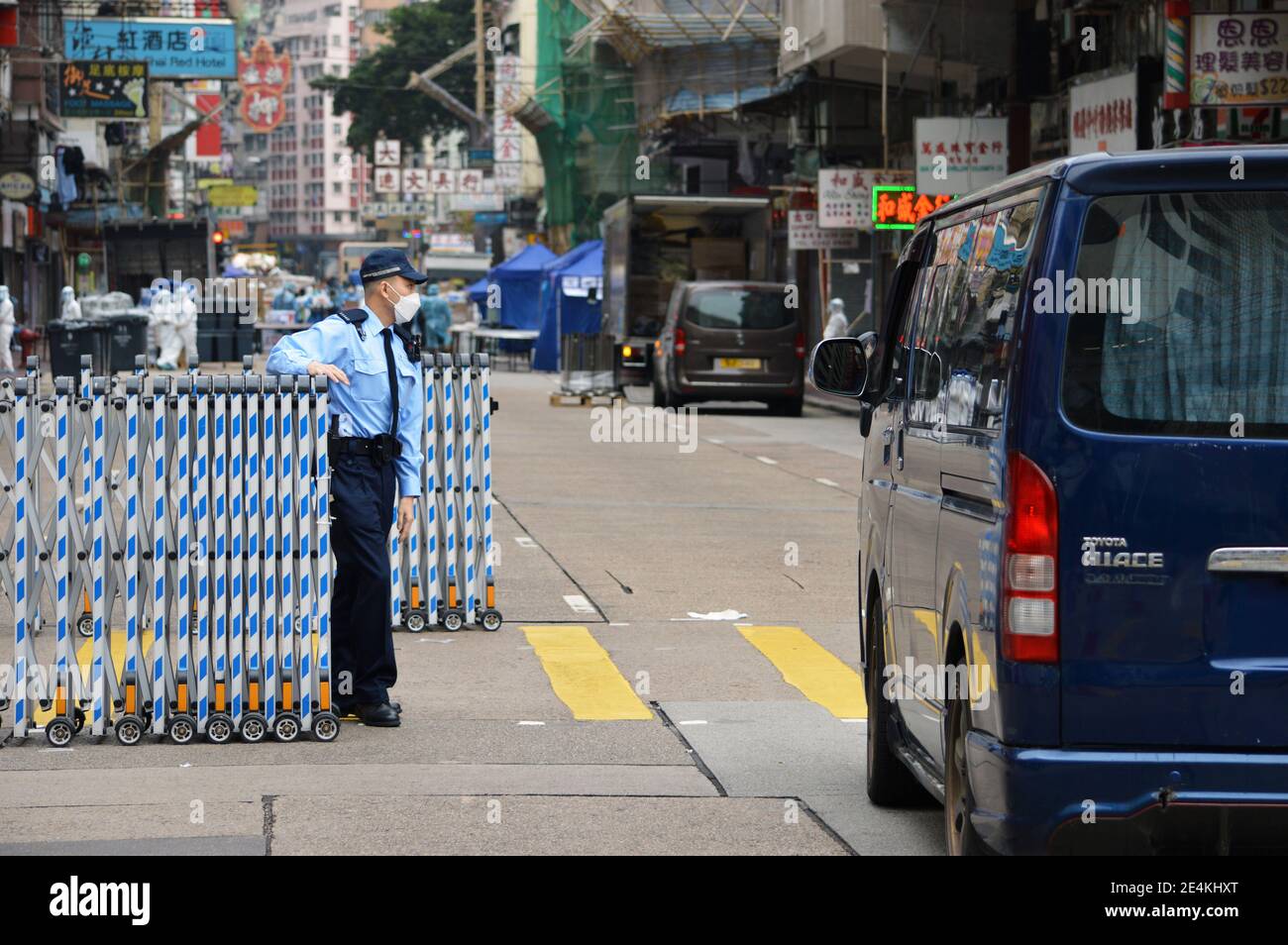 Hong Kong Police roadblock during Covid-19 coronavirus pandemic lockdown in Yau Ma Tei, Kowloon, Hong Kong in January 2021 Stock Photo