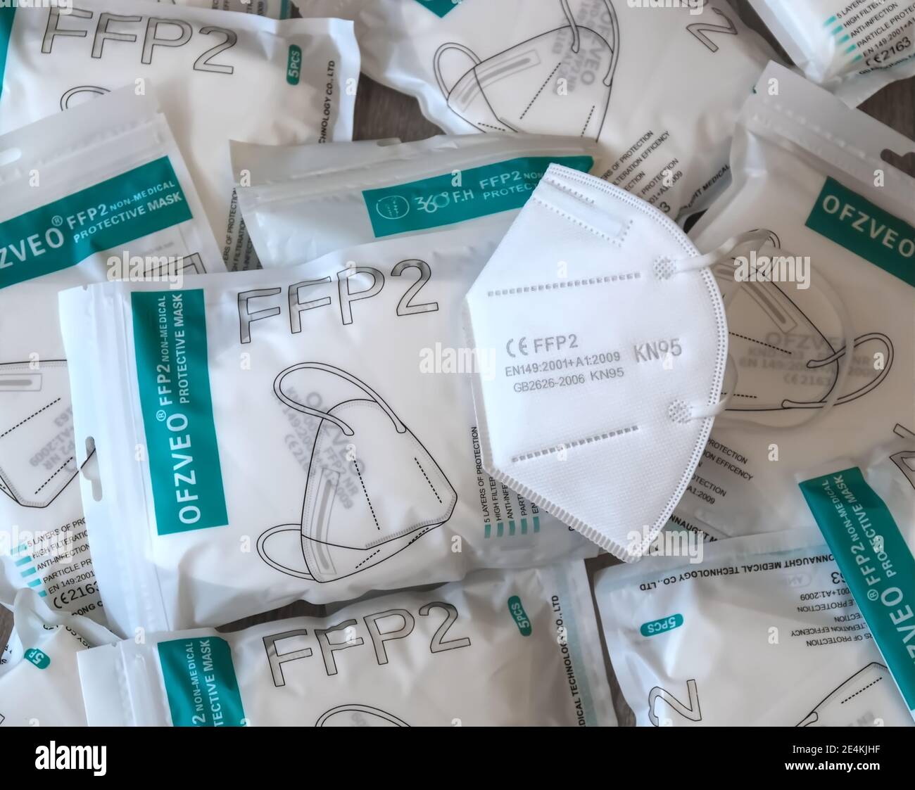 Many Packages with FFP2 protection masks to help against Corona pandemic Stock Photo