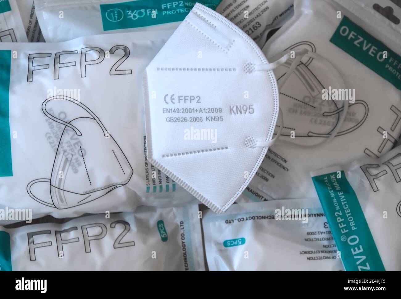 Many Packages with FFP2 protection masks to help against Corona pandemic Stock Photo