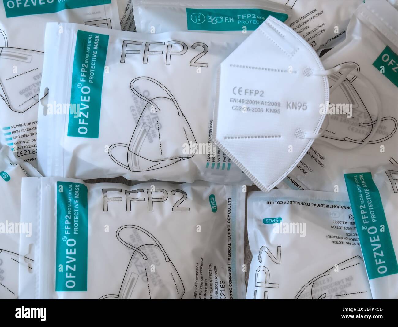 Many Packages with FFP2 protection masks to help against Corona pandemic Stock Photo