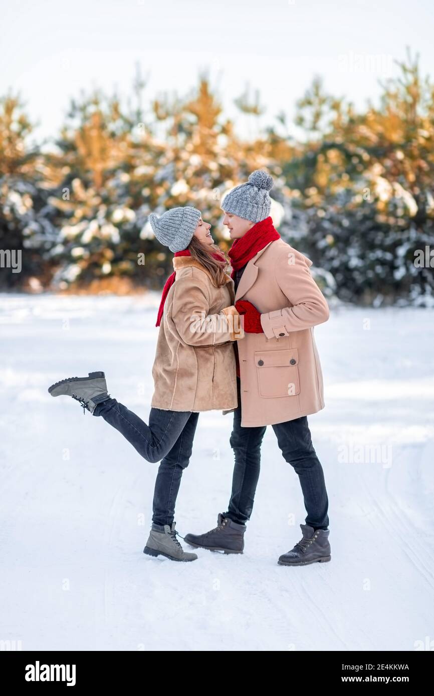 Romantic young couple bonding while walking on winter day Stock Photo
