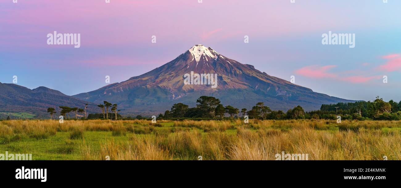 sunset at cone volcano mount taranaki in new zealand Stock Photo